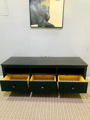 Low black wooden TV stand / media unit with three drawers