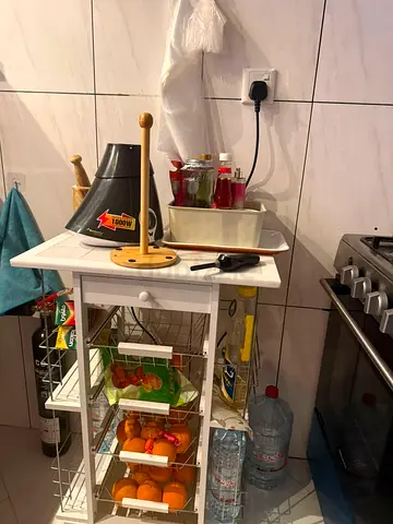Small white kitchen trolley with wire baskets and drawer