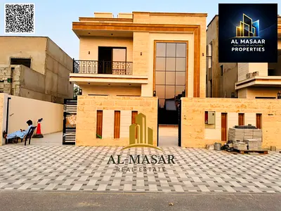Freehold two-story villa with a roof terrace, stone façade, and large courtyard; price includes registration and ownership fees.