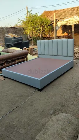 Grey upholstered double bed frame with padded headboard - good condition