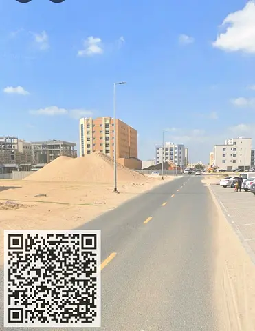 Residential-commercial land for sale (Ground + 6 floors) in Ajman Industrial Area.