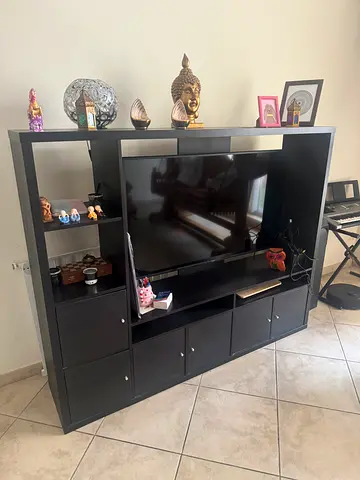 Dark brown wooden entertainment center / TV unit with storage