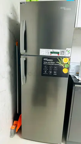 Double-door stainless refrigerator, top freezer — good working condition