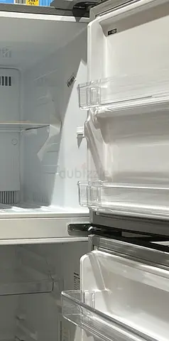 Clean double-door refrigerator interior — good working condition