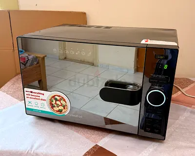 Used Black Mirrored Door Microwave Oven - Good Working Condition