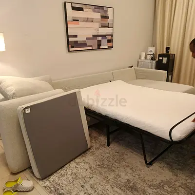 L-shaped sofa bed with pull-out mattress