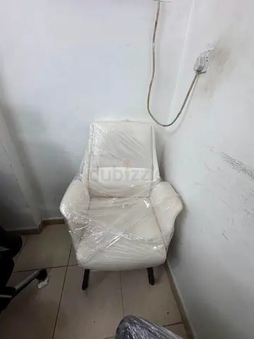 White upholstered armchair in good condition