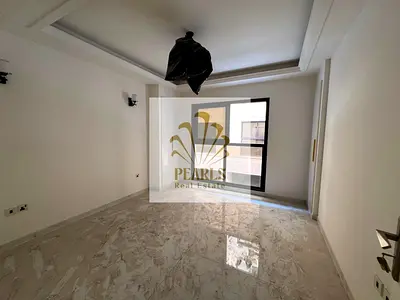 Annual rent in Al Tallah, first tenant, 2BR + hall with majlis, 3 baths, balcony & built-in wardrobes, pool & jacuzzi, 1 month free. Rent AED 48k, 4–6