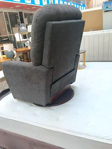 Grey fabric swivel recliner chair in good condition