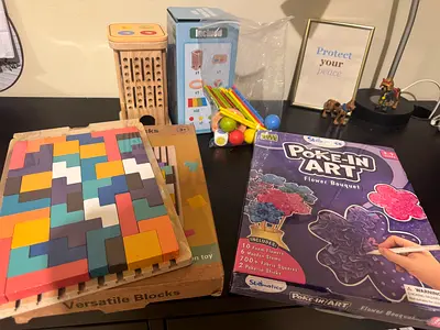 Collection of educational toys including versatile blocks and poke-in art set.