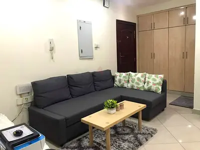 L-shaped dark grey fabric sofa with chaise - good condition