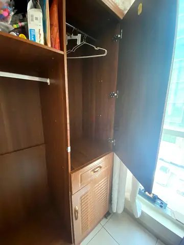 Solid wooden wardrobewith storage compartments in superb condition
