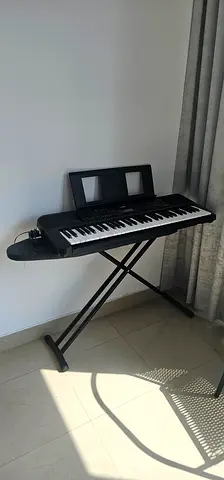 Yamaha PSR-E283 Portable Electronic Keyboard with Stand