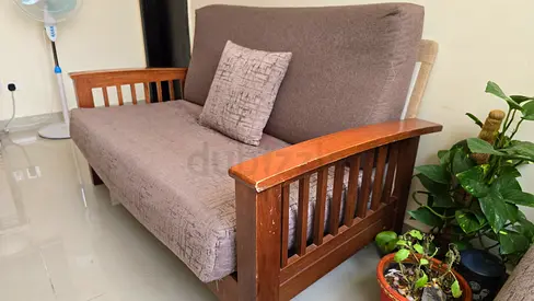 3-seater wooden frame sofa with brown cushions – good condition