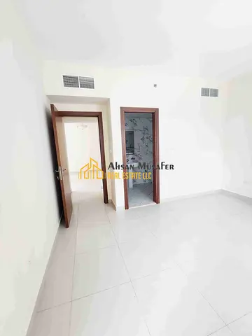 (BRAND NEW BUILDING+ PARKING FREE+10DAYS FREE+WARDROBES ALSO HAVE) EASY EXIT TO DUBAI NEAR RTA BUS STOP LAST UNIT 1BHK WITH 2WASHROOM 6CHQS PAYMENT