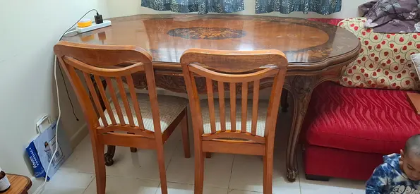 Wooden dining table with 6 chairs and its extendable on both sides— classic carved design