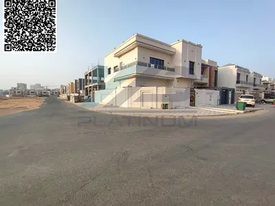 For rent in Al Yasmeen, Ajman: Corner villa with a swimming pool and waterfall.