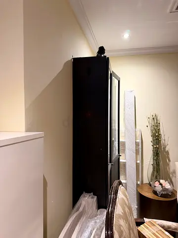 Tall black wardrobe / armoire in good condition