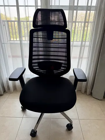 Black ergonomic mesh office chair with headrest (good condition)