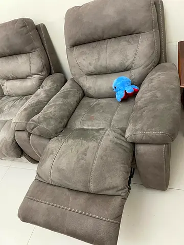 Pair of grey fabric recliner chairs — comfortable 2-seater set