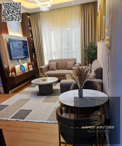 1BR hall in Garden City Ajman with new furniture, décor, parquet flooring, free parking; yearly rent AED 36,000; 4 or 6 payments; AED 4,000 security c