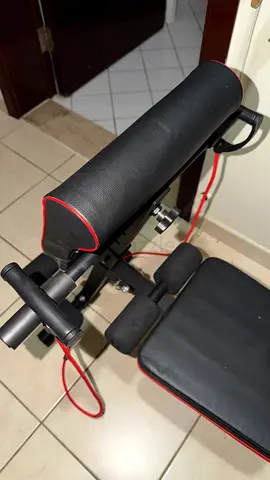 Adjustable sit-up / workout bench with resistance bands - good condition