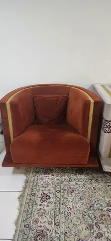 Two Single velvet armchair in rust orange with gold trim
