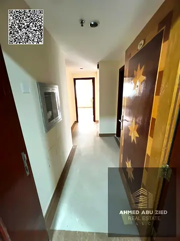 Spacious 1BR in Al Nuaimiya 1, balcony with open view, near Al Jurf Bridge, 4 payments, cash deposit, prime location near services.