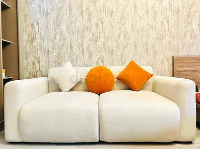 Light beige 2-seater sofa in excellent condition