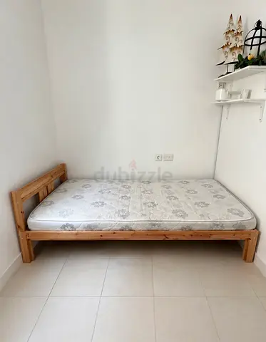 Wooden bed frame and mattress