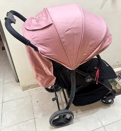 Pink lightweight 4-wheel baby stroller (good condition)