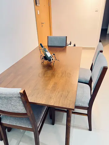 Wooden dining table with 4 upholstered chairs - good condition
