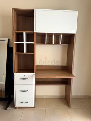 Desk with storage cabinets and shelves