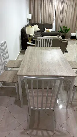 Light wood dining table with 4 chairs — good condition
