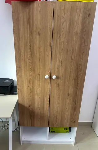 Two-door wooden wardrobe with lower cubby storage - Excellent condition for kids