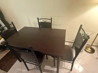 Dining table and 4 chairs for sale due to departure