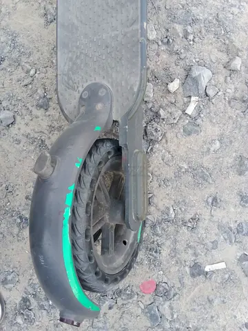Used electric scooter (rear wheel) — needs repair with charger