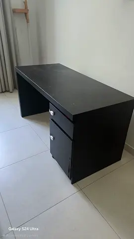 Black wooden office desk with 2 drawers.