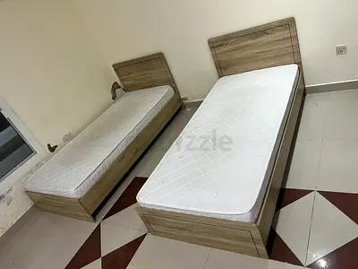 Two single wooden beds with mattresses - good condition