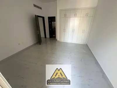 1BR apartment in Al Jurf 2, 2 baths, balcony, wardrobes, central AC, AED 35K, 6 payments.