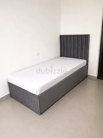 New Single grey upholstered bed with storage base and mattress