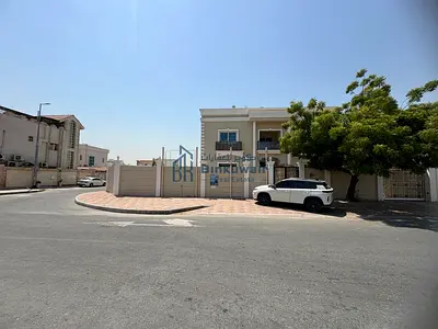 For sale: Corner villa, two floors, in Al Nakheelat area, Sharjah. New villa, two paved streets.