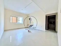 SPACIOUS ONE BEDROOM-HALL | CENTRAL AC | ON ROAD BUILDING | PRIME LOCATION | EASY ACCESS TO DUBAI