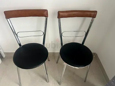 Set of 2 metal dining chairs with leather-look backrests