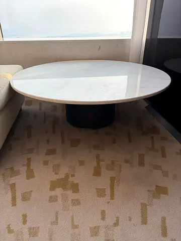 Round Marble-Top Coffee Table with Black Pedestal Base