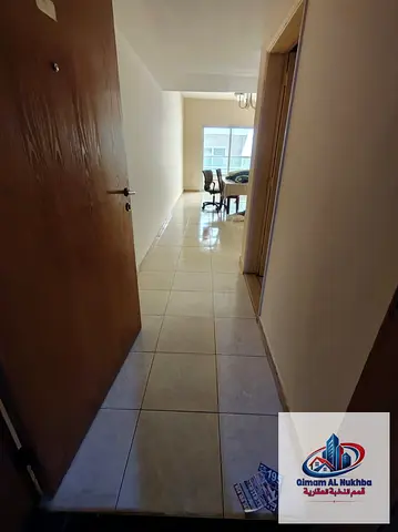 Cheapest 1-bedroom apartment in Al Qasimia Al Mahatta, featuring central AC and a balcony. One month free, prime location with easy access to Dubai an