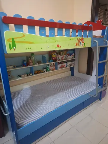 Blue wooden kids bunk bed with drawers and ladder - good condition