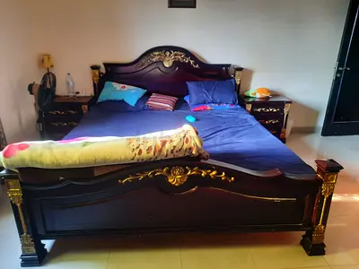 Solid Wooden King-Size Bed with Ornate Carved Headboard and Footboard