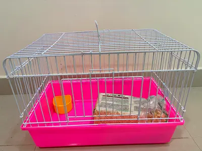 Small pink bird/rabbit cage with tray and litter