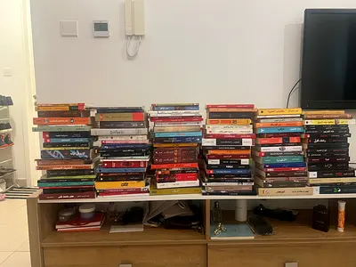 Used mixed collection of English and Arabic books - novels, nonfiction, textbooks